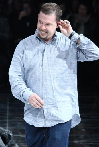 Alexander McQueen in a light blue shirt at his fall 2009 collection.