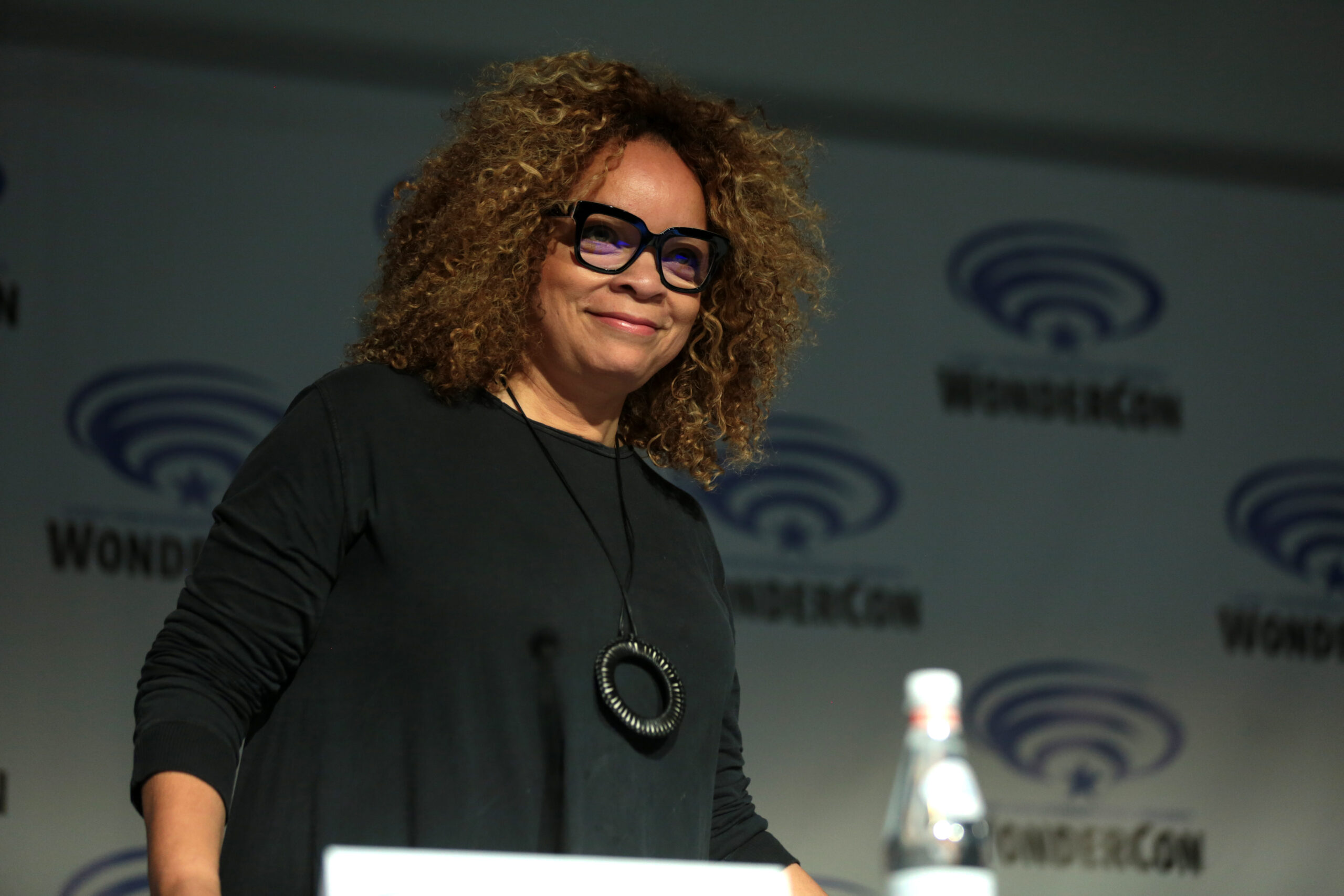 Ruth E. Carter wearing glasses and black clothing at WonderCon in 2018.