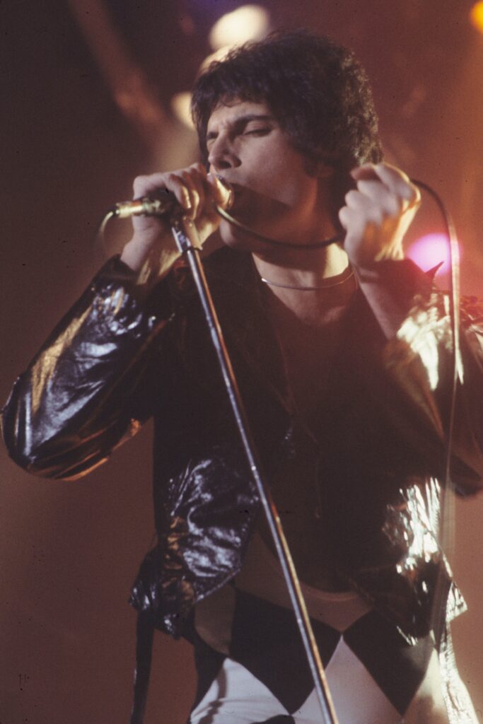 Freddie Mercury singing on stage in New Haven in November 1977; archival photograph.