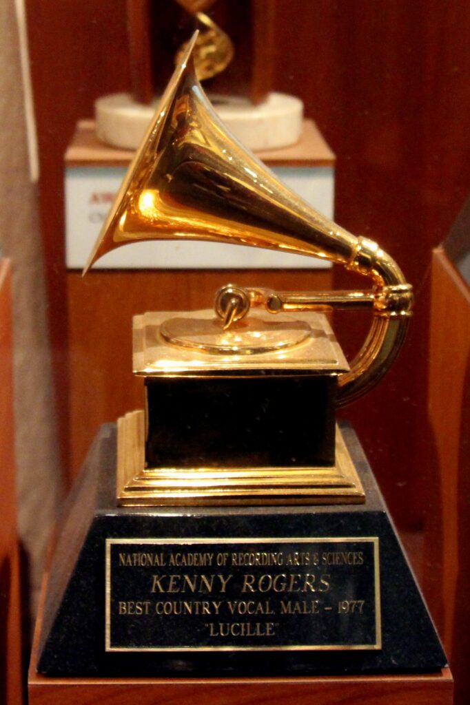 Close-up of a historic Grammy gramophone trophy in a museum display